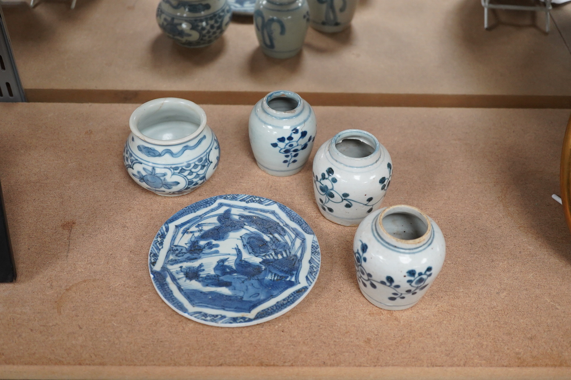 Three Chinese blue and white jars and a dish centre, late Ming dynasty, largest 13cm in diameter. Condition - fair